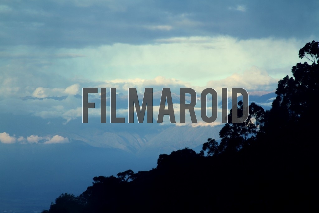 A section of one of the Andean Mountains chains surrounded by clouds during golden hour