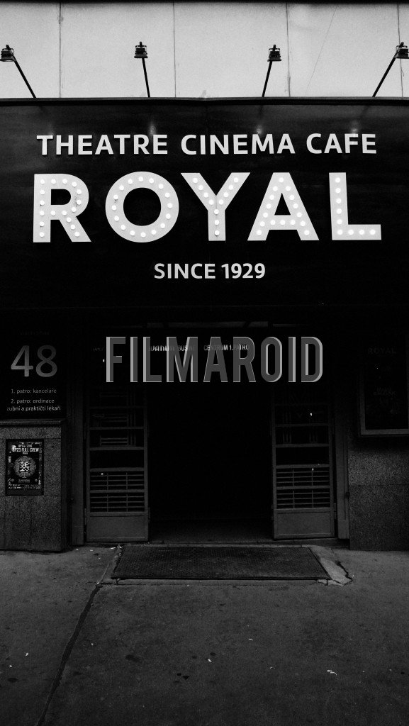 Classic movie theater with big vintage marquee over the entrance door