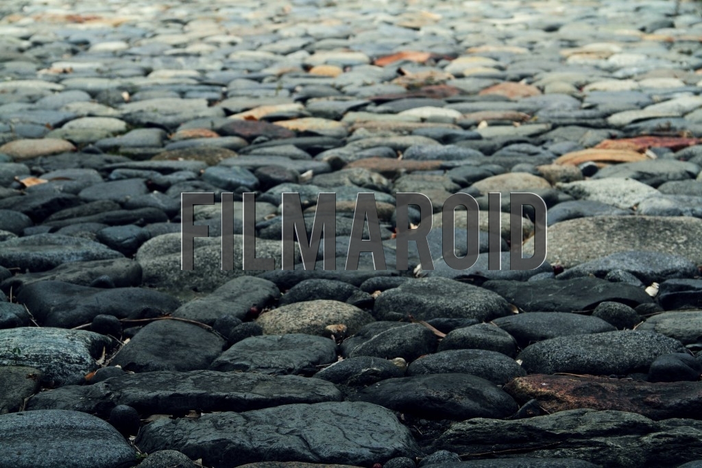Texture view of an old colonial dark stone street in a Colombian hacienda