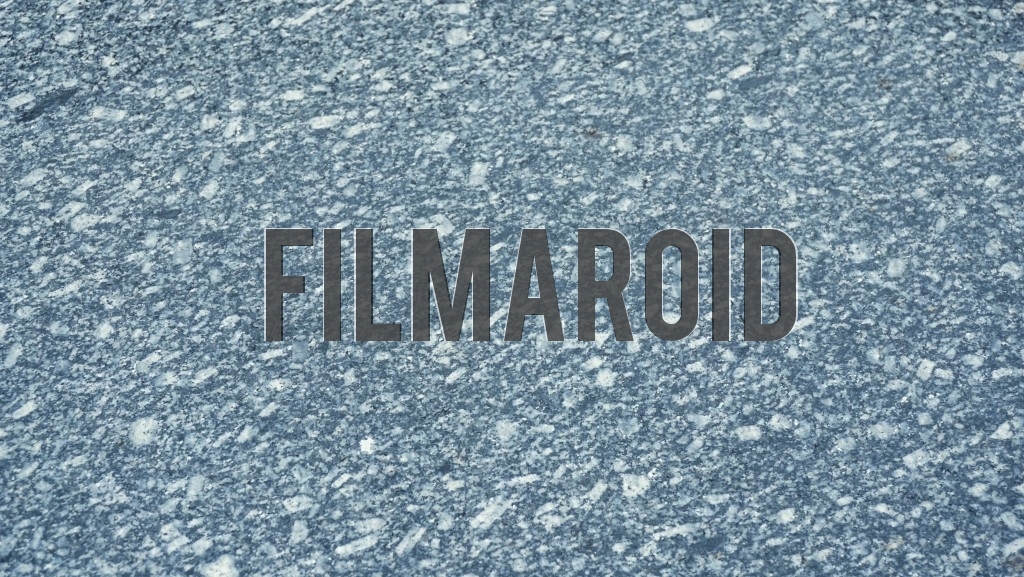 Detail view of a large gray granite surface with white accents