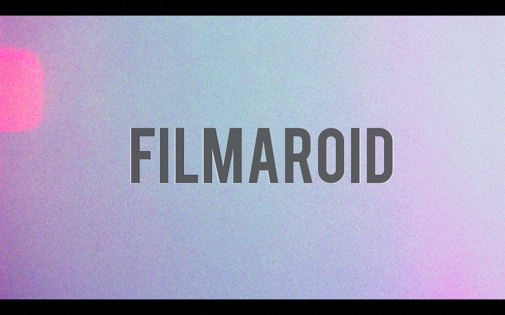 A scan of a vintage film with some light leak and a sprocket hole on left side