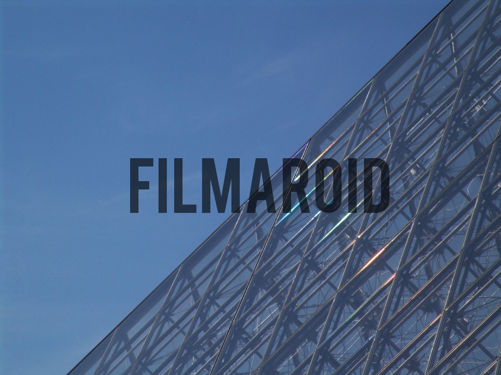 Detail shot of the iconic Louvre pyramid in Paris