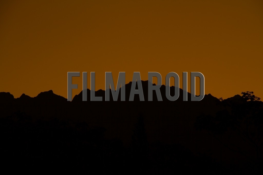 Beautiful afternoon view of the Andean mountain range silhouette against a golden sky background
