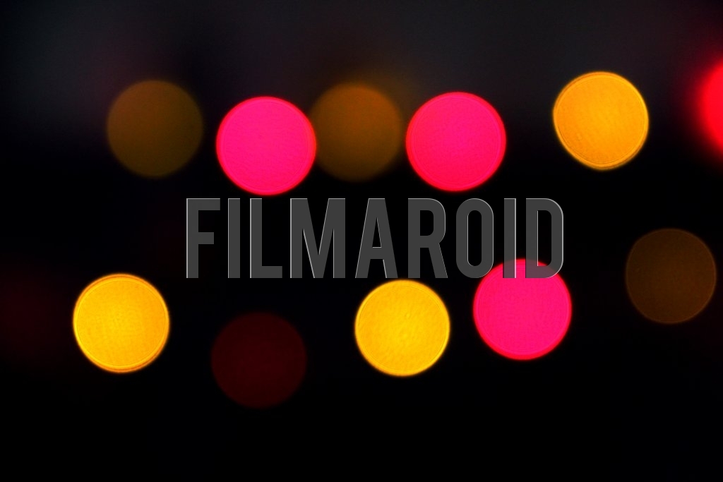 A background of red magenta yellow lights out of focus