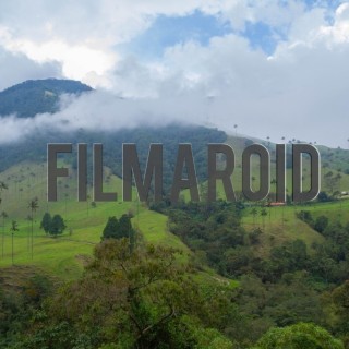 South american landscape with green mountains farmhouses and trails with clouds and blue sky - A collection of stock photos about Landscapes