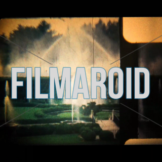 8mm footage of classic beautiful gardens with bridges and multiple fountains - Vintage 8mm footage panning across fountains and gardens with beautiful classic lanscaping and bridges decorating the scene during one summer day