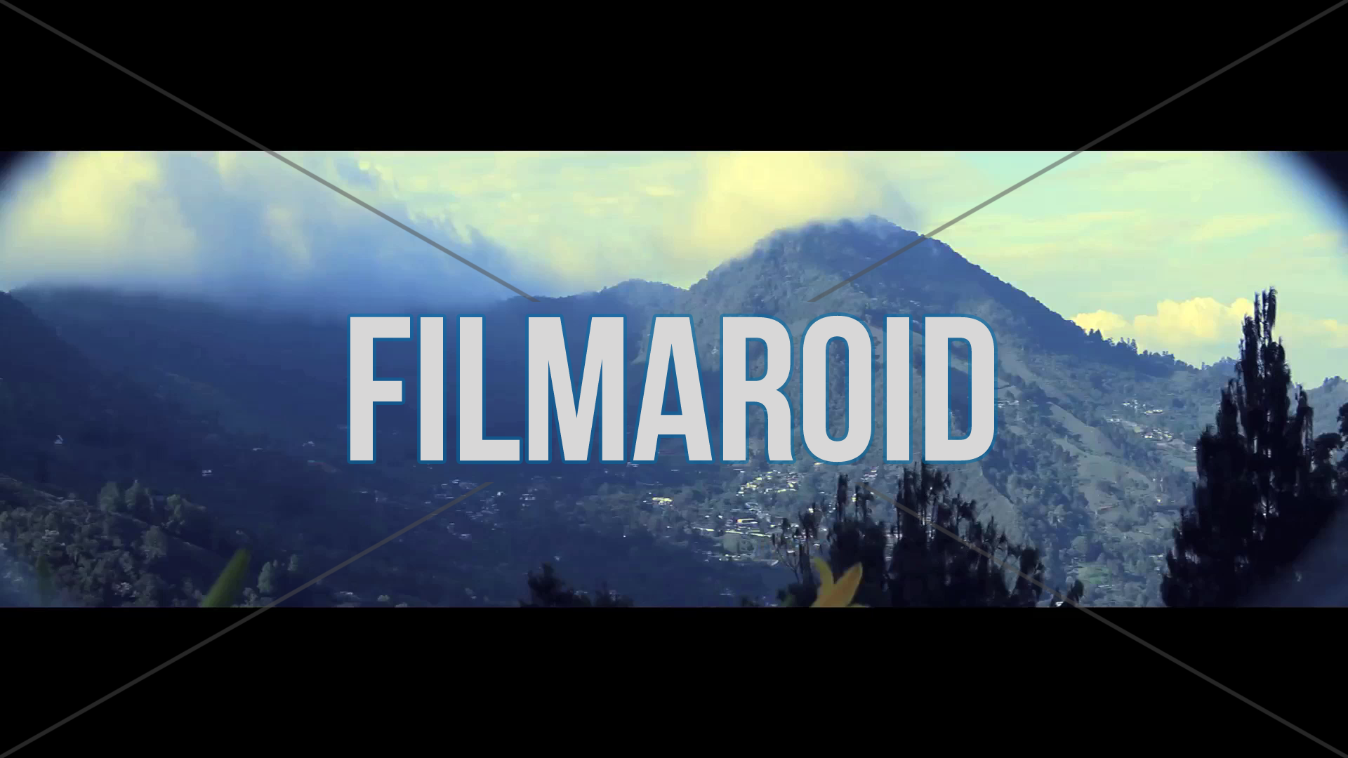 Landscape view - Anamorphic lens view with vignetting of a beautiful landscape with mountains, flowers, trees and clouds