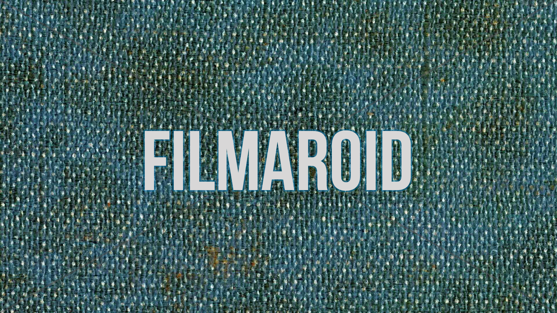 4k horizontal slow motion footage of weathered or soiled blue denim fabric texture with stains, wear and other rough features