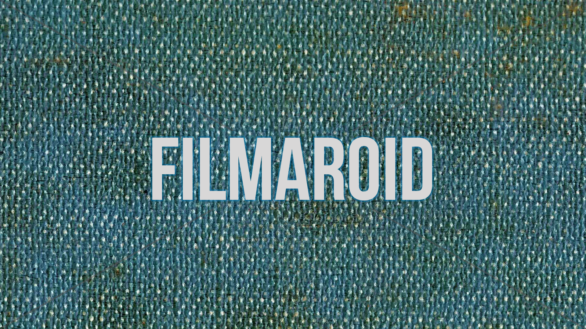 4k vertical slow motion footage of weathered or soiled blue denim fabric texture with stains, wear and other rough features